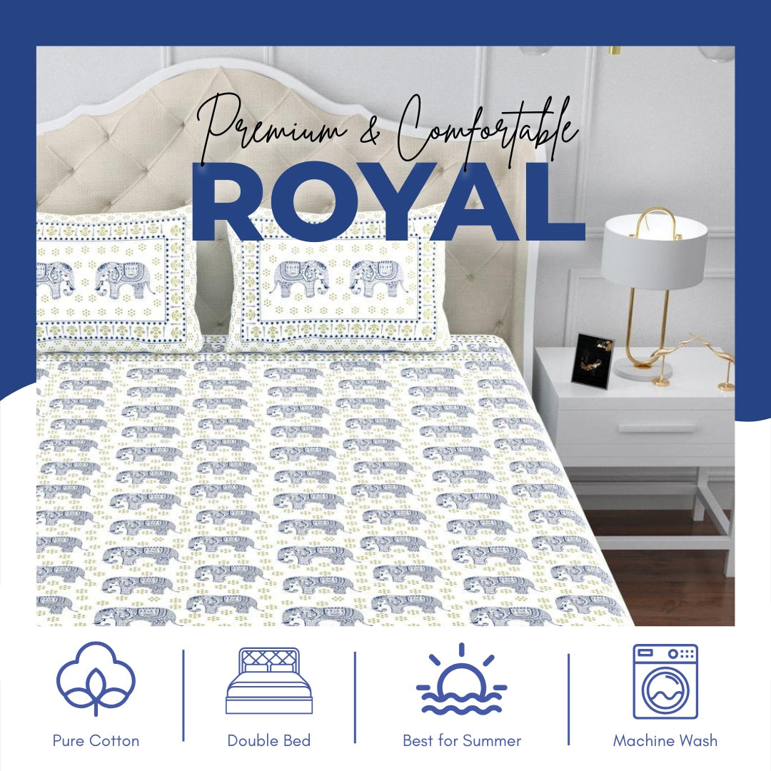 Bedding set with elephant pattern on a bed in a bedroom setting, featuring the brand 'Royal'.