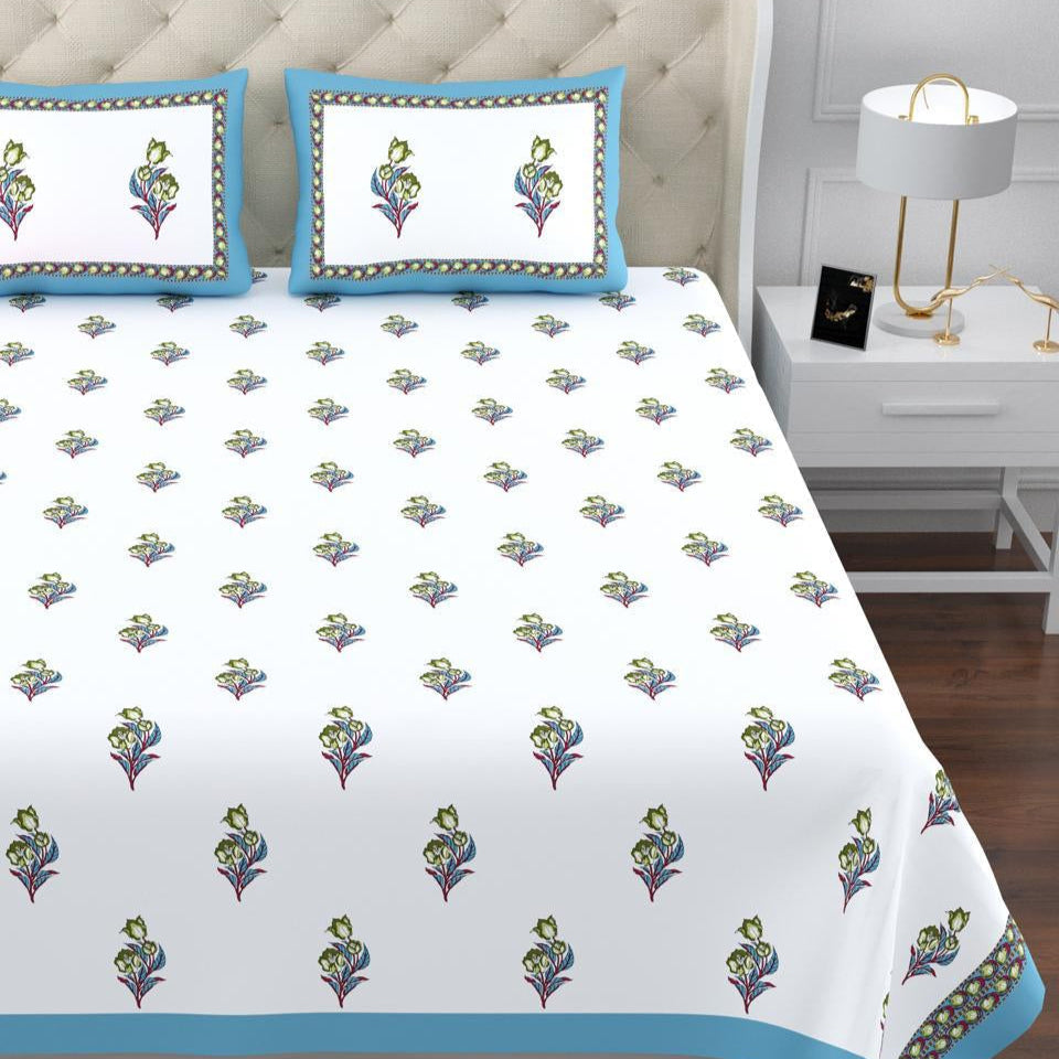 Bedspread with floral pattern on a bed in a bedroom setting. restezzy